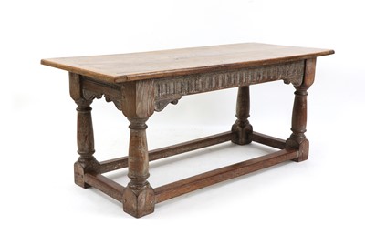 Lot 414 - An oak refectory table