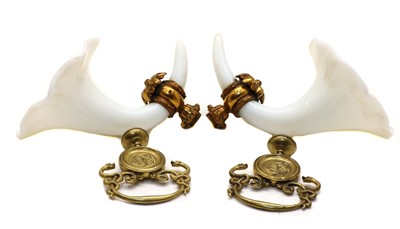 Lot 124 - A pair of Victorian opaline glass and gilt metal curtain tie backs