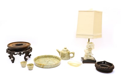 Lot 139A - A Chinese hardstone table lamp decorated with carved Koi Carp and foliage