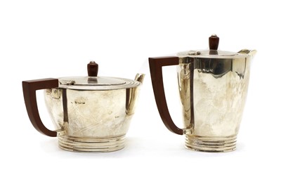 Lot 11 - A silver teapot and a hot water jug