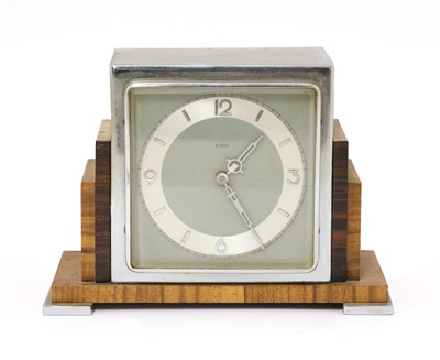 Lot 173 - An Art Deco walnut and rosewood mantel clock