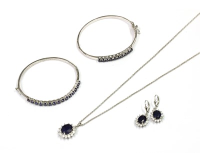 Lot 282 - A sterling silver sapphire set bangle