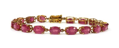 Lot 90 - A 9ct gold fracture filled ruby set bracelet