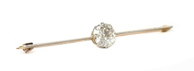 Lot 1165 - A gold and platinum single stone diamond bar brooch