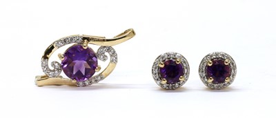 Lot 312 - A 9ct gold amethyst and zircon pendant