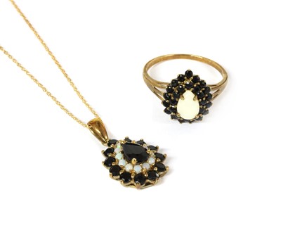 Lot 112 - A 9ct gold sapphire and opal pendant