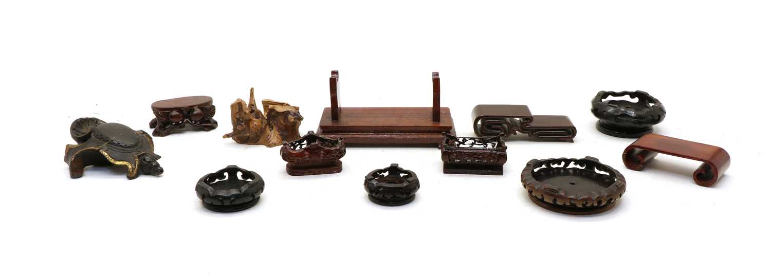 Lot 162 - A collection of Chinese wood stands
