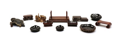 Lot 162 - A collection of Chinese wood stands