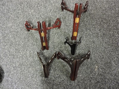 Lot 162 - A collection of Chinese wood stands