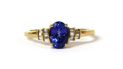 Lot 115 - An 18ct gold tanzanite and diamond ring