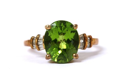 Lot 130 - A 9ct gold peridot and diamond ring