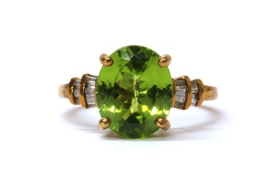 Lot 148 - A 9ct gold peridot and diamond ring