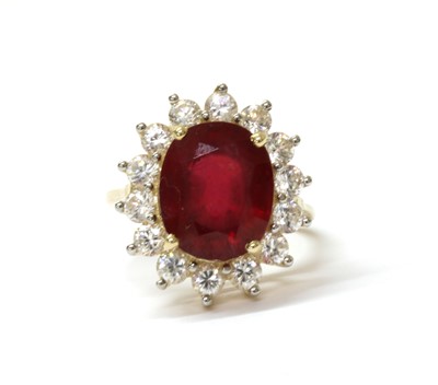 Lot 217 - A 9ct gold fracture filled ruby and zircon cluster ring