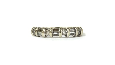 Lot 47 - A white gold diamond half eternity ring