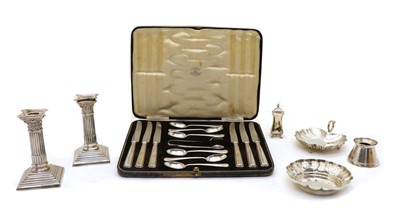 Lot 19 - A pair of silver plated Corinthian form candlesticks
