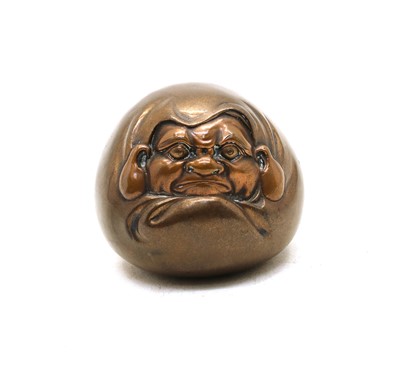 Lot 87 - A Japanese lacquered copper figure of a man in a cloak