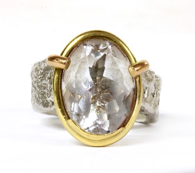 Lot 160 - A sterling silver and 18ct gold single stone ring, by Shelley Thomas