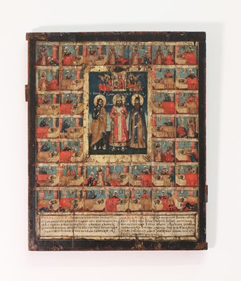 Lot 93 - An icon of three chosen saints with scenes from their lives