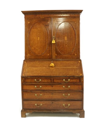 Lot 482 - A George III oak and crossbanded bureau bookcase