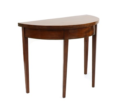 Lot 244 - A 19th century strung mahogany demi-lune foldover tea table