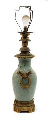 Lot 143 - A Chinese moulded celadon vase