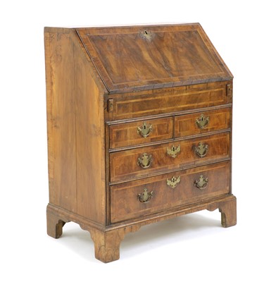 Lot 241 - A George II feather strung and crossbanded walnut bureau