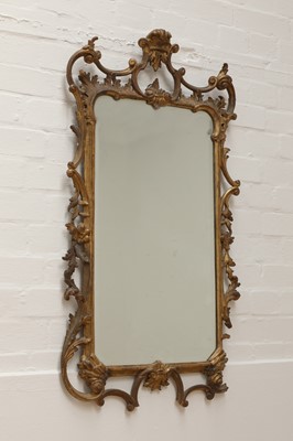 Lot 71 - A George III-style carved giltwood wall mirror
