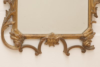 Lot 71 - A George III-style carved giltwood wall mirror