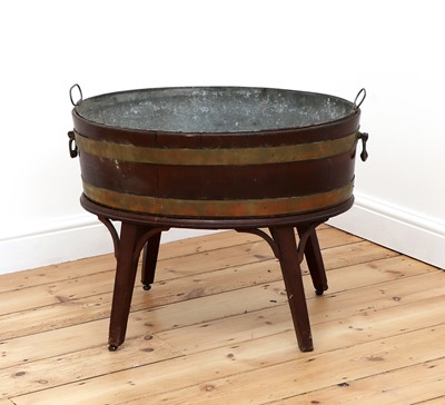 Lot 72 - A George III brass-bound mahogany oval wine cooler