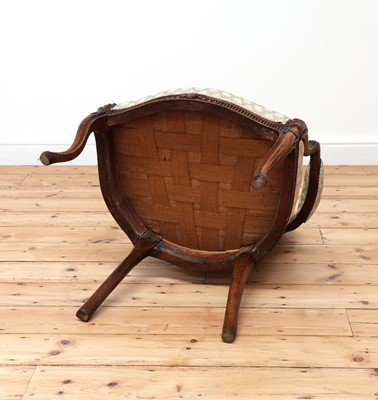 Lot 62 - A carved beech open armchair