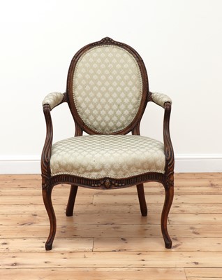 Lot 62 - A carved beech open armchair