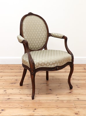 Lot 62 - A carved beech open armchair