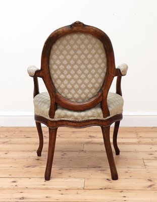 Lot 62 - A carved beech open armchair