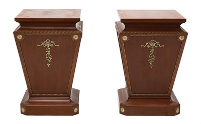 Lot 632 - A pair of mahogany pedestals