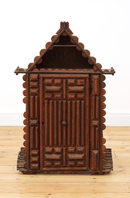 Lot 197A - A 'tramp art' wall-hanging cabinet
