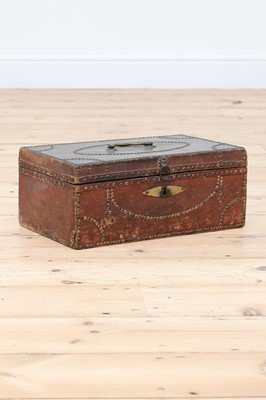 Lot 65 - A red leather and studded deeds box