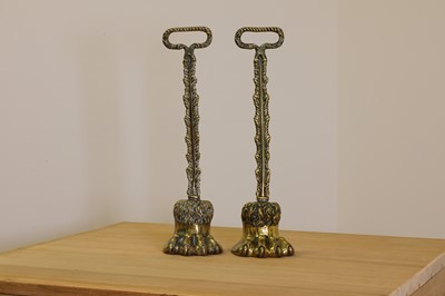 Lot 419 - A pair of cast brass door porters