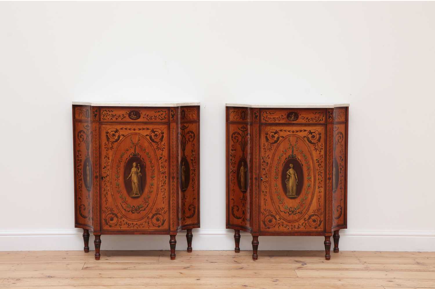 Lot 70 - A pair of George III satinwood and crossbanded pier cabinets