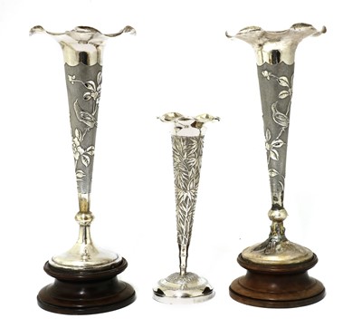 Lot 144 - A pair of Chinese export silver repoussé vases
