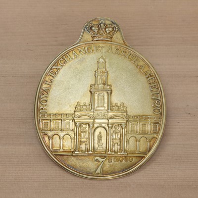 Lot 373 - A George III silver gilt Royal Exchange Assurance fireman's arm badge
