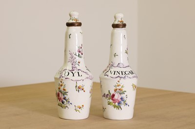 Lot 429 - A pair of English enamel condiment bottles