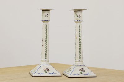 Lot 432 - A pair of enamel candlesticks