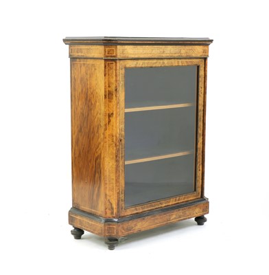 Lot 255 - A Victorian figured walnut and ebonised pier cabinet