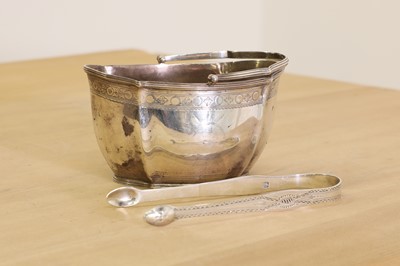 Lot 6 - A George III silver swing-handled sugar basket