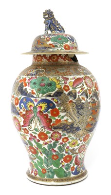 Lot 299 - A Chinese export clobbered blue and white jar and cover