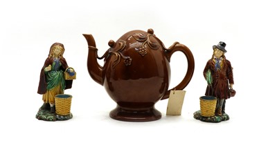 Lot 223 - A pair of Minton majolica figures of street traders
