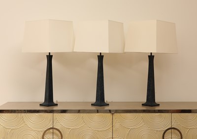 Lot 651 - A set of three Maison Charles 'Pyramide' patinated bronze table lamps