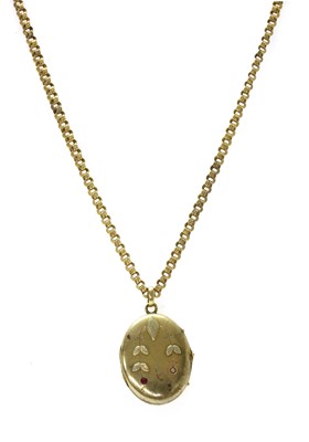 Lot 16 - A Russian gold ruby set locket and chain