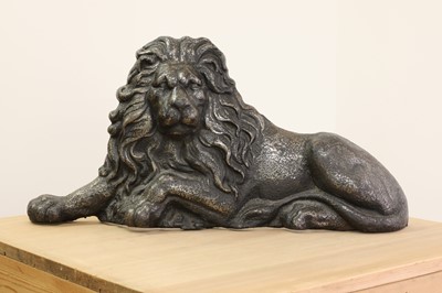 Lot 29 - A large cast iron recumbent lion