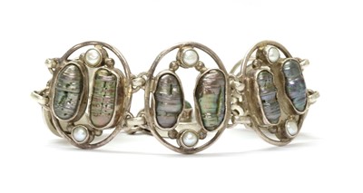 Lot 252 - An Arts & Crafts style silver cultured baroque freshwater pearl and split pearl bracelet